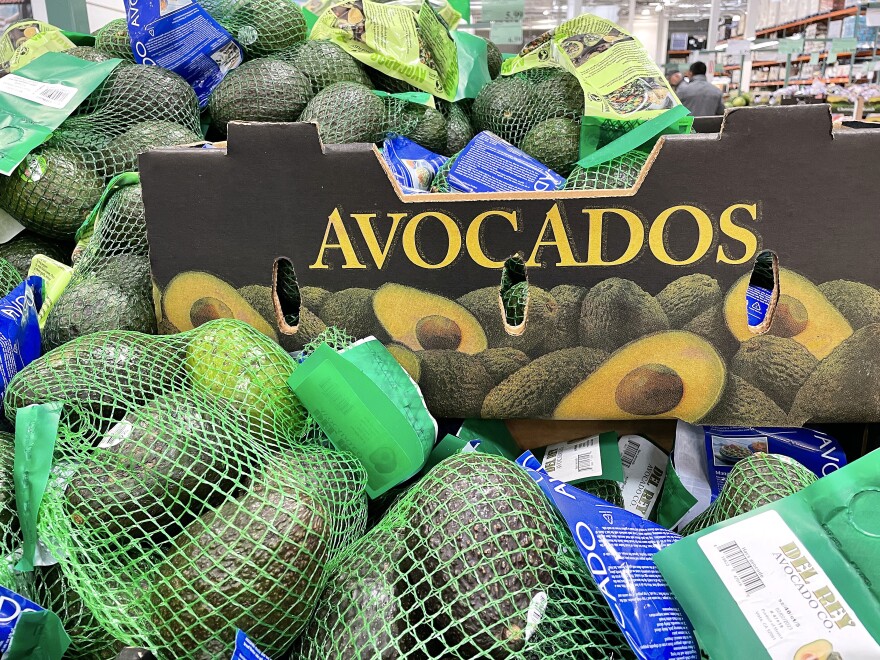 Bags of avocados are placed on a shelf at Costco in Novato, California.