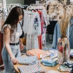 A woman buys sustainable fashion