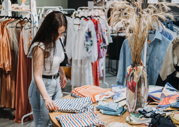 A woman buys sustainable fashion