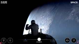 Issacman appears in a SpaceX capsule for a historic spacewalk